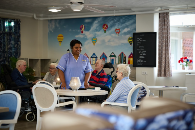 nurse in a communal space of the care home
