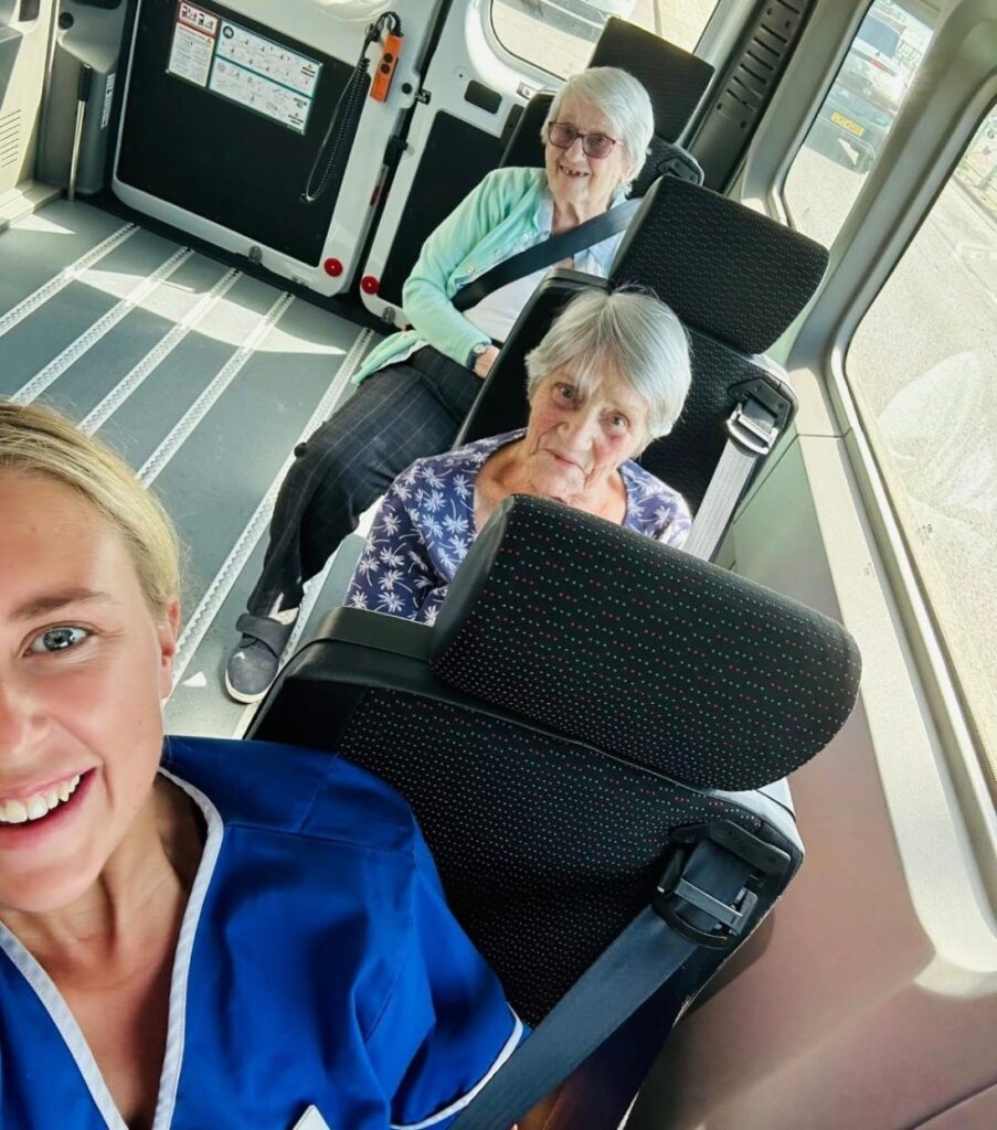 Residents and career taking a selfie in the van
