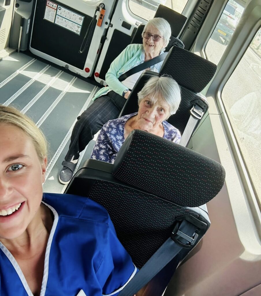Residents and career taking a selfie in the van
