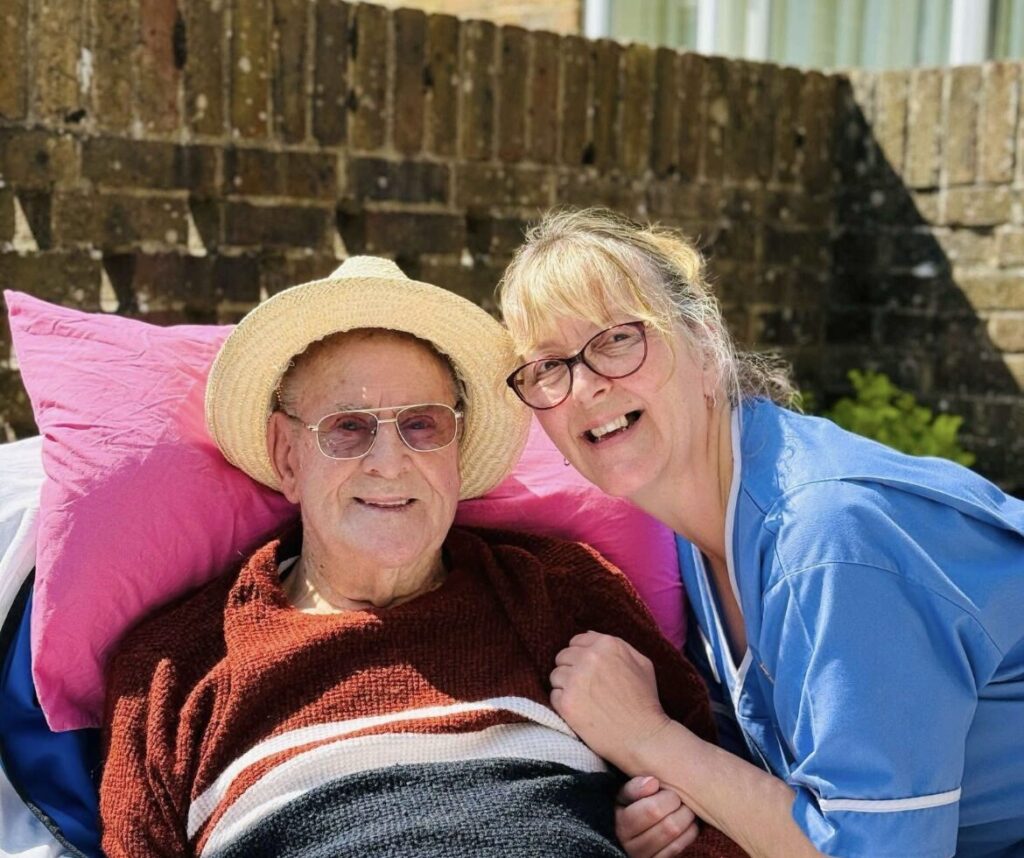 nurse & care resident smiling