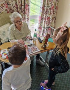 children visiting the care home delivering easter eggs
