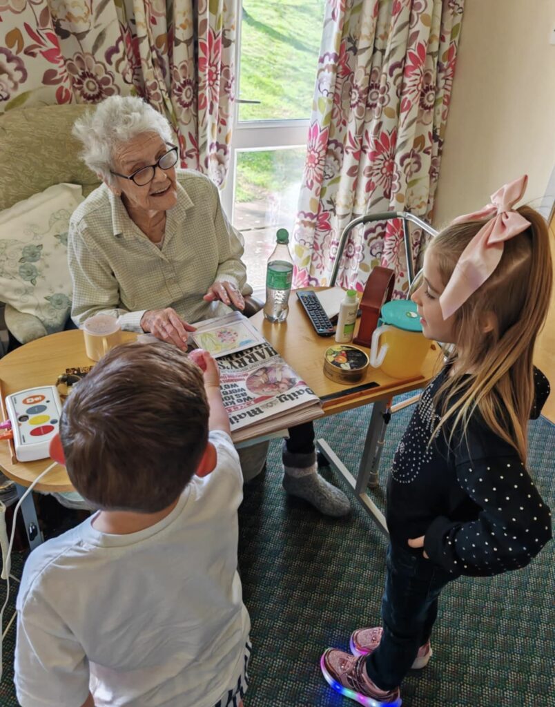 children visiting the care home delivering easter eggs