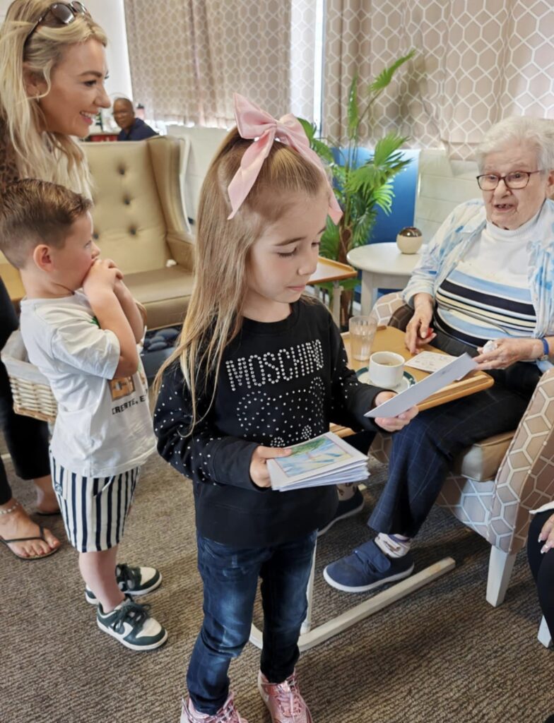 children visiting the care home delivering easter eggs