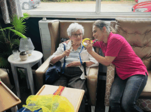 specialist and resident doing an engaging activity