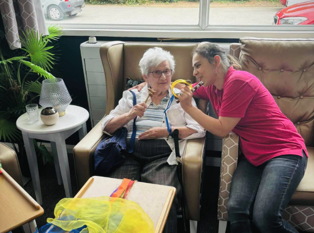 specialist and resident doing an engaging activity