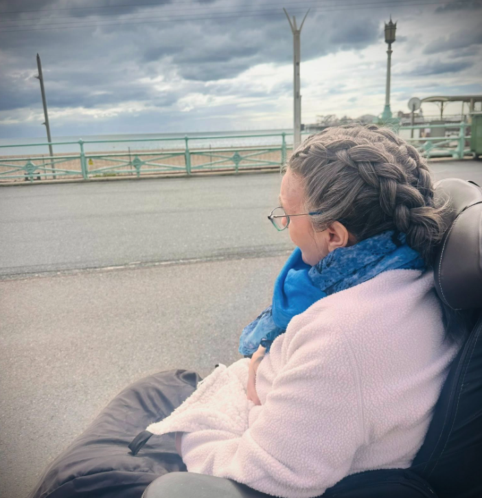 female resident watching the sea on Brighton Beach